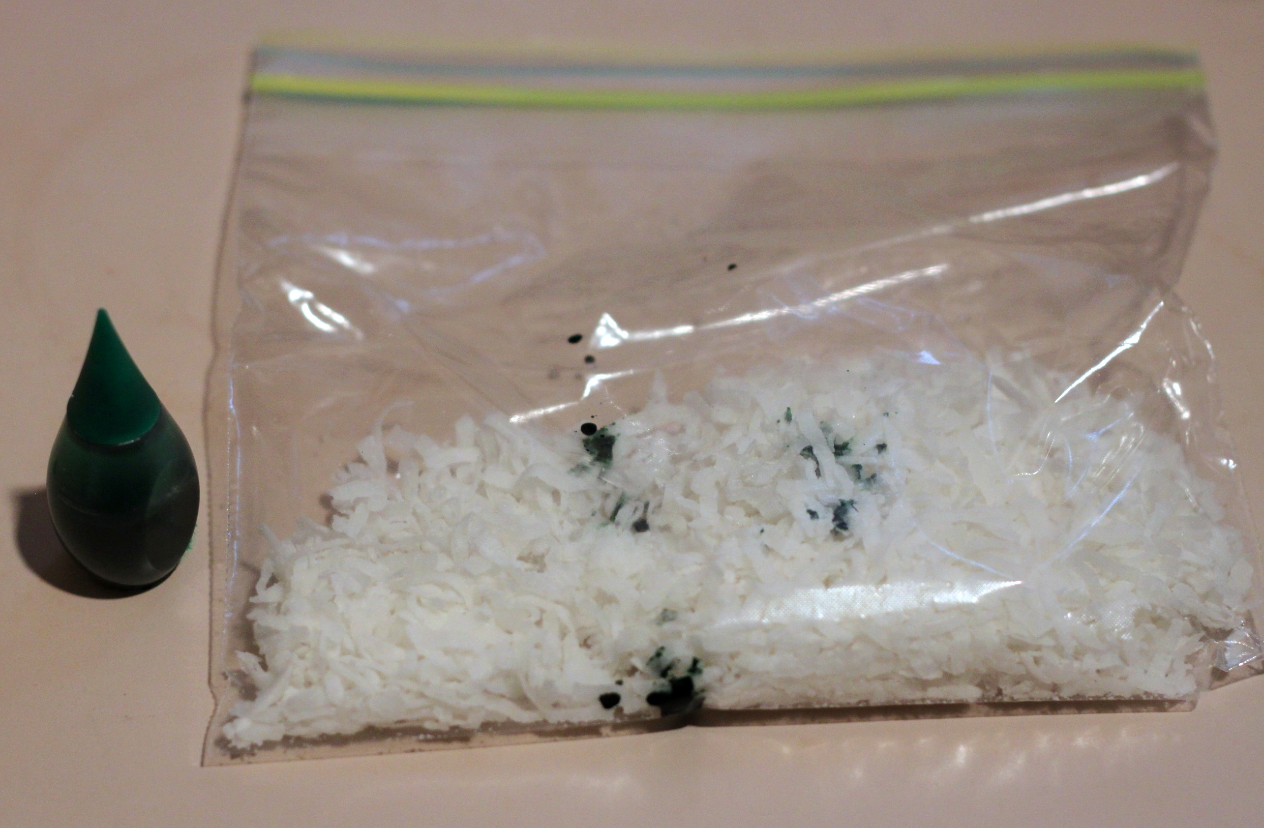 Green dye and coconut in bag