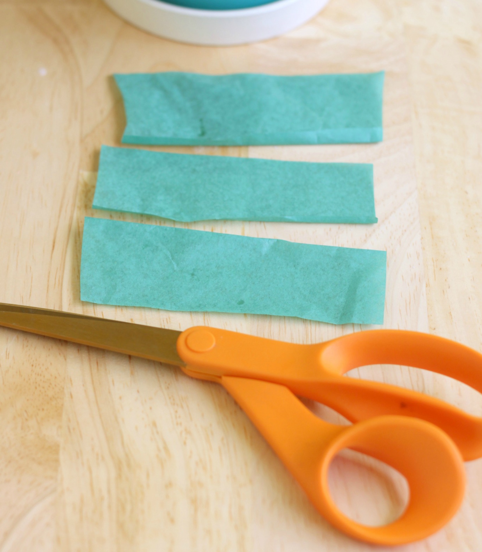 Cut strips of green tissue paper cropped