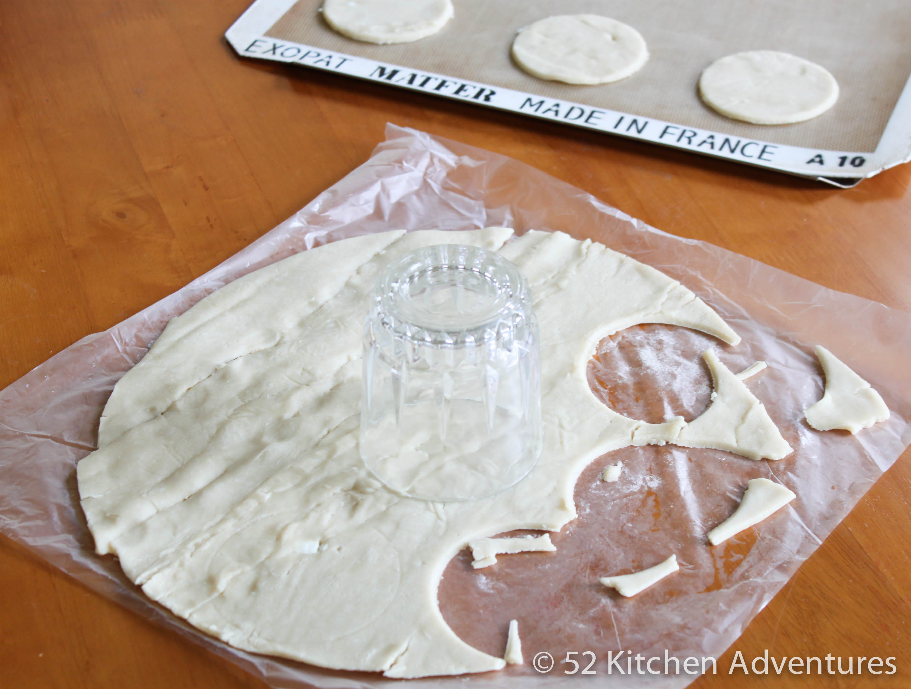 Cut hand pie dough into 3 inch circles