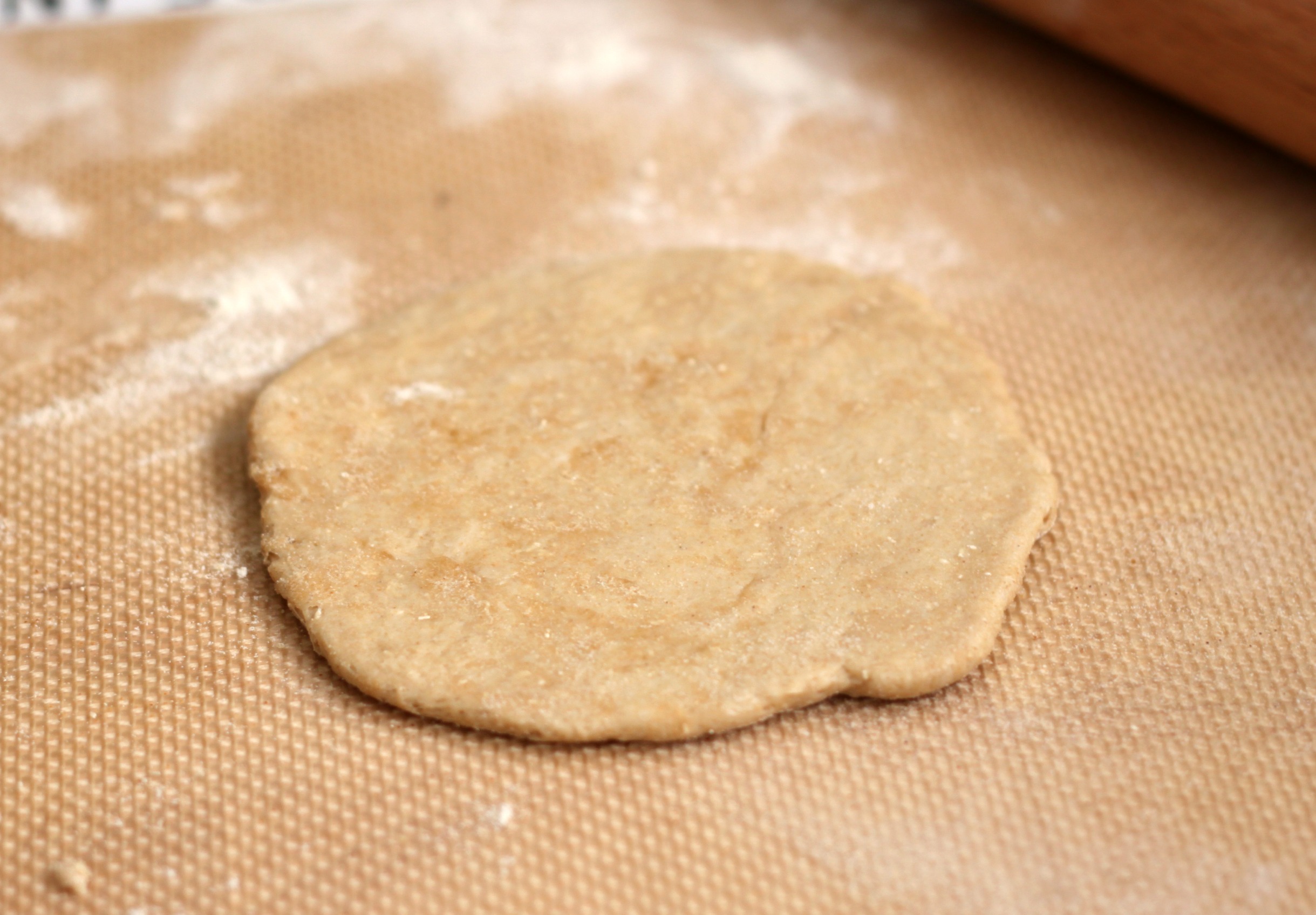 Roll pizza dough to 18 thickness