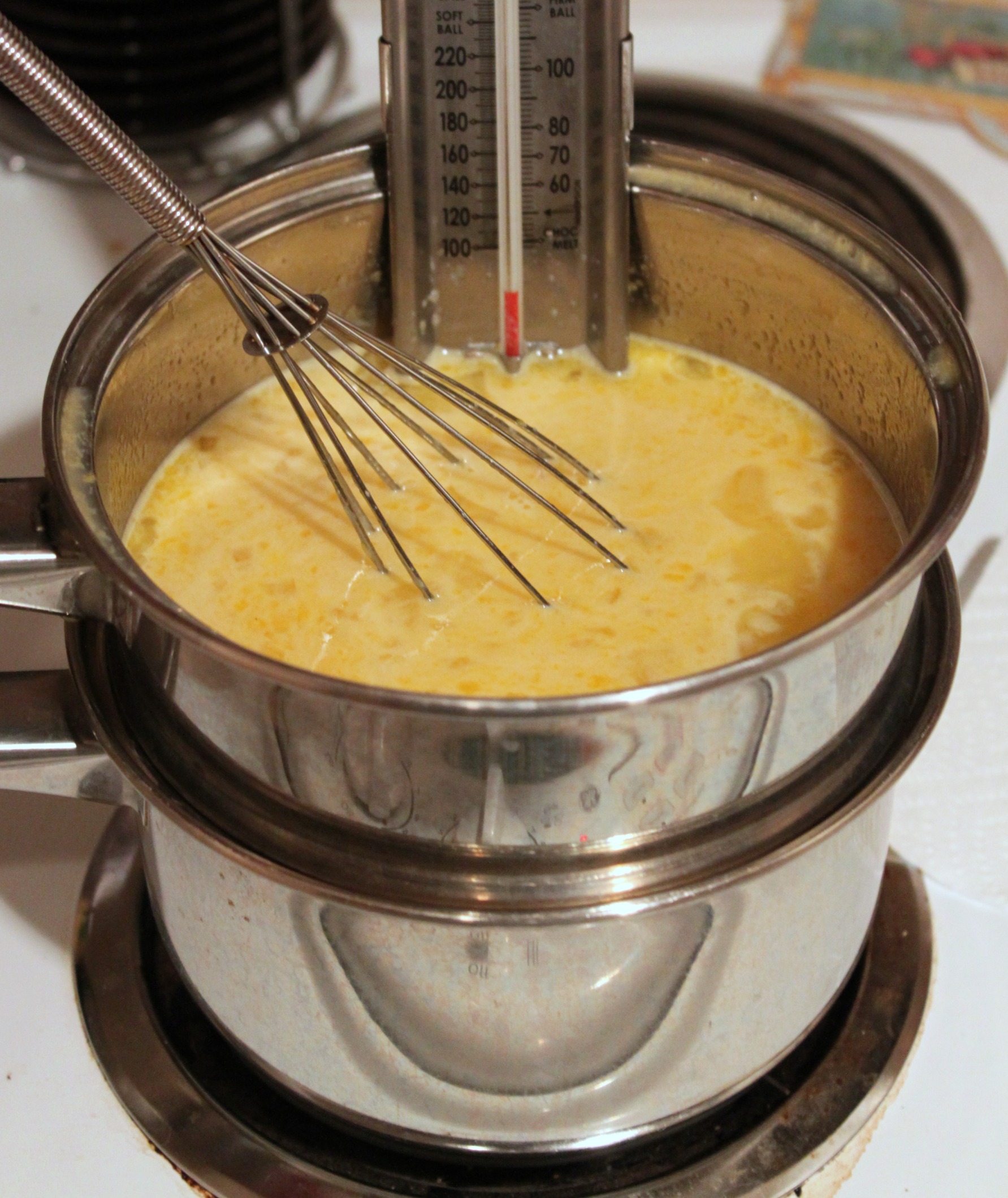 Combine lemon curd ingredients in double boiler